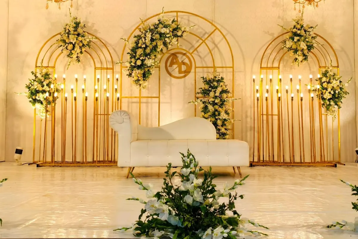 White and gold stage with candle stands — Shadhi Catering and Event Management