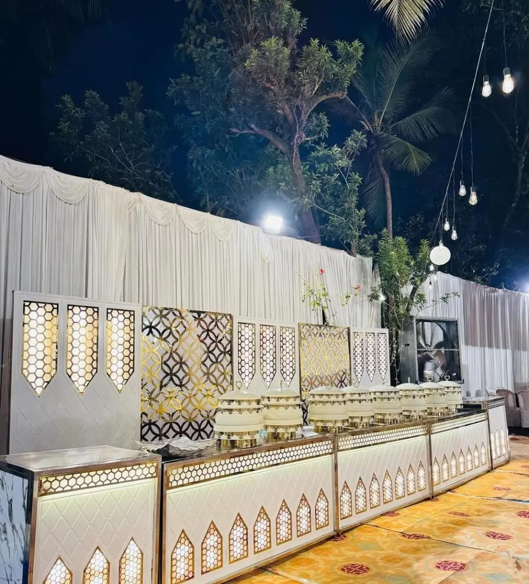 Night buffet with lit lattice counters — Shadhi Catering and Event Management